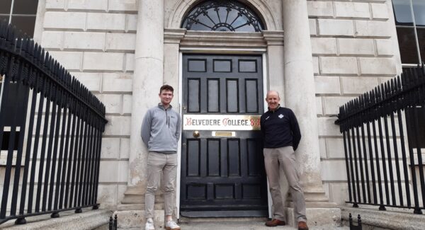 Sam Duff, an overseas volunteer poses with Padraig Sawn, a teacher at Belevere college SJ. they both pose at the entrance to Belevere College.