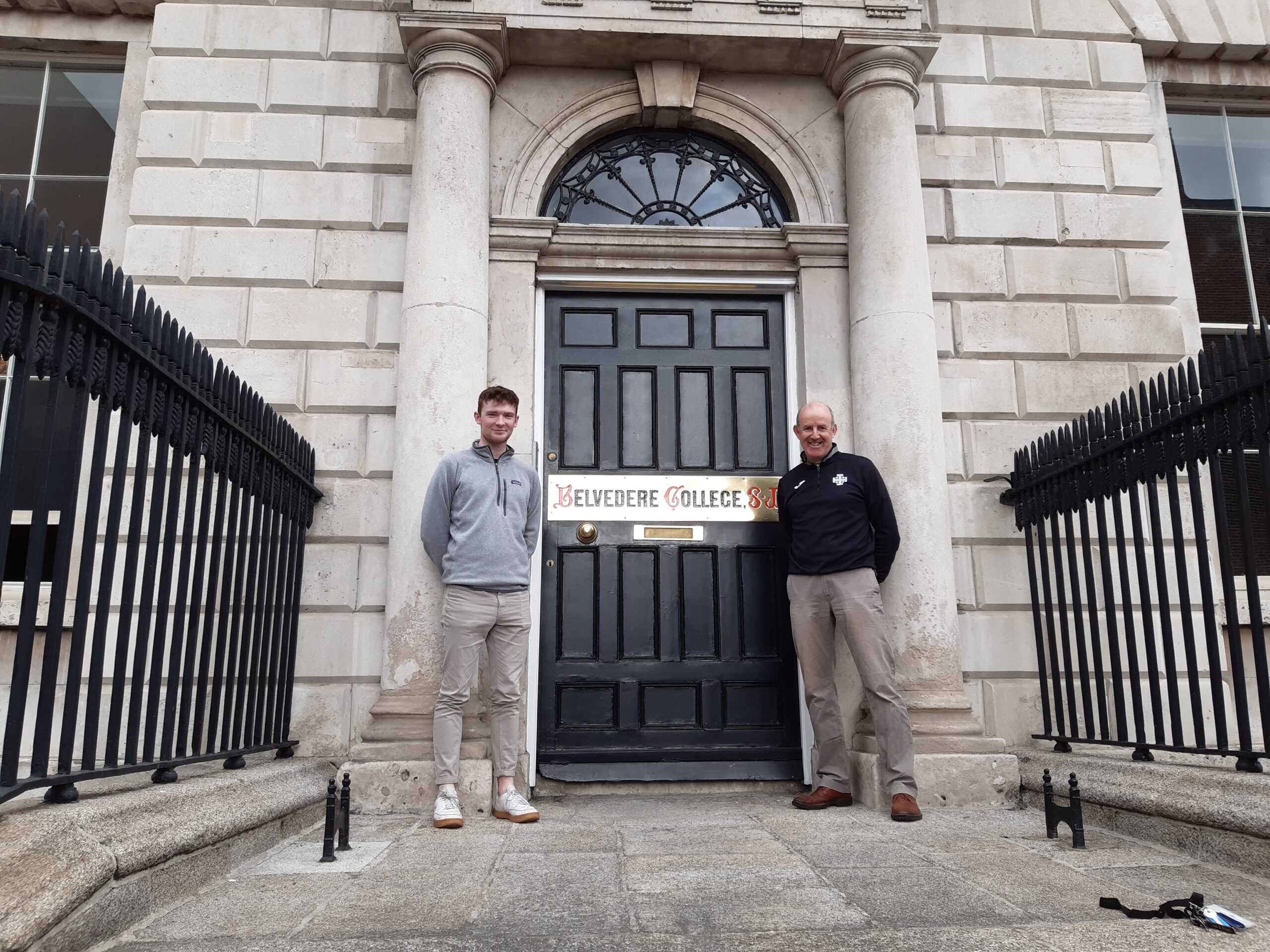 Sam Duff, an overseas volunteer poses with Padraig Sawn, a teacher at Belevere college SJ. they both pose at the entrance to Belevere College.