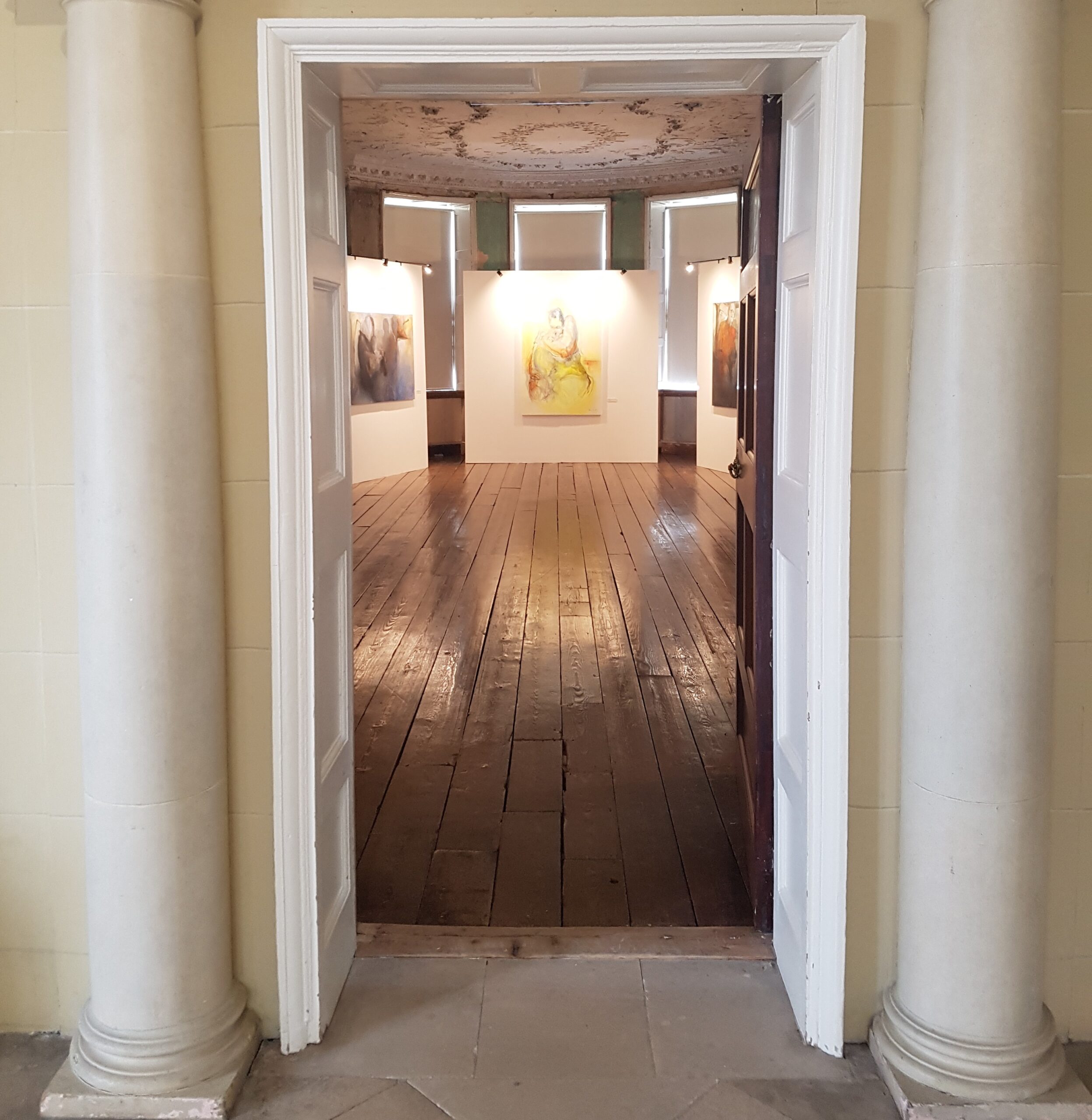 doorway revealing art exhibit gallery