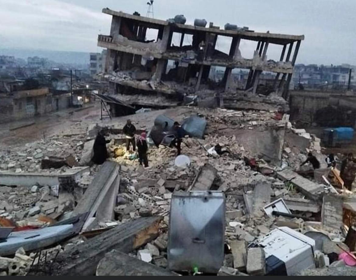 collapsed building in Aleppo. aftermath of earthquake.