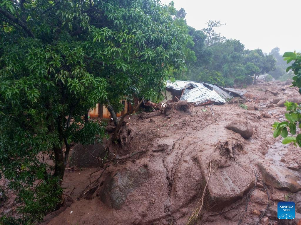 road and house destroyed in mudslide. aftermath of Cyclone