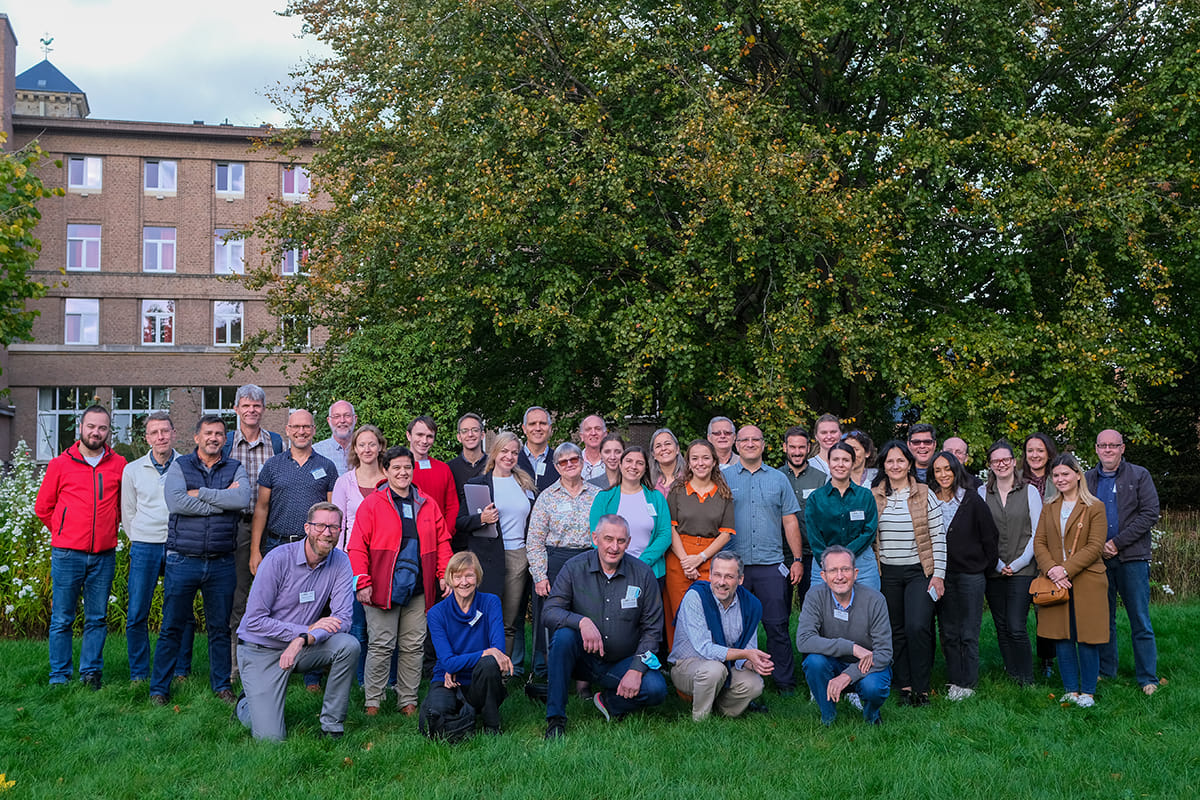 Group photo outside - regional coordination group meeting pose for photo.