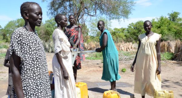 women farmers in South Sudan gathering water at a village borehole