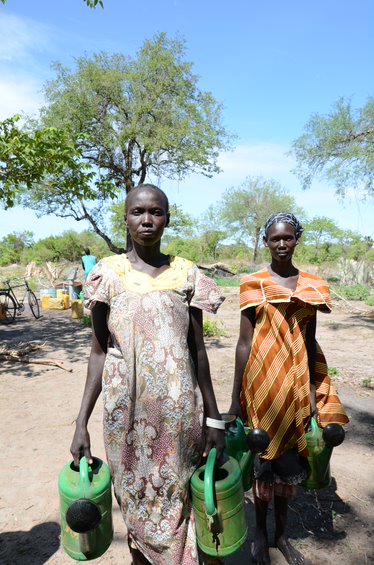 women farmers in South Sudan with watering cans