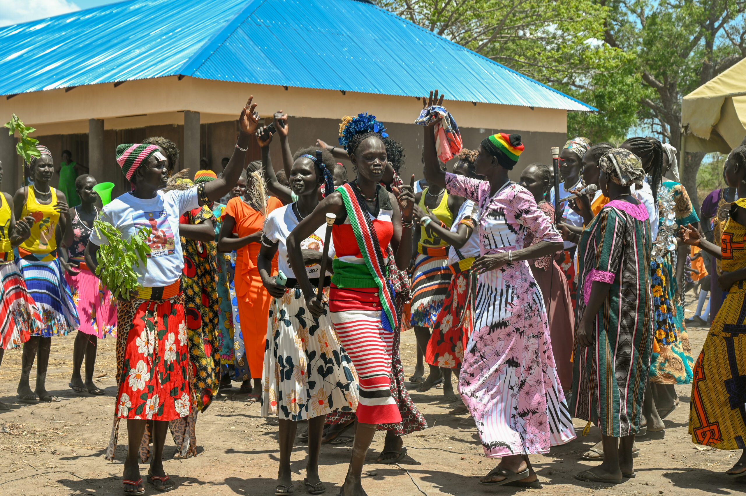 villager dance in celebration of new school building