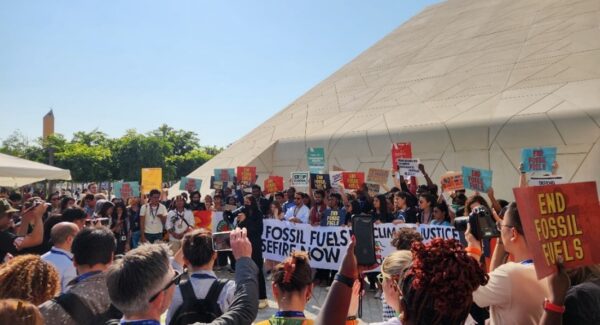 activists demonstrate against fossil fuel at COP28 in Dubai