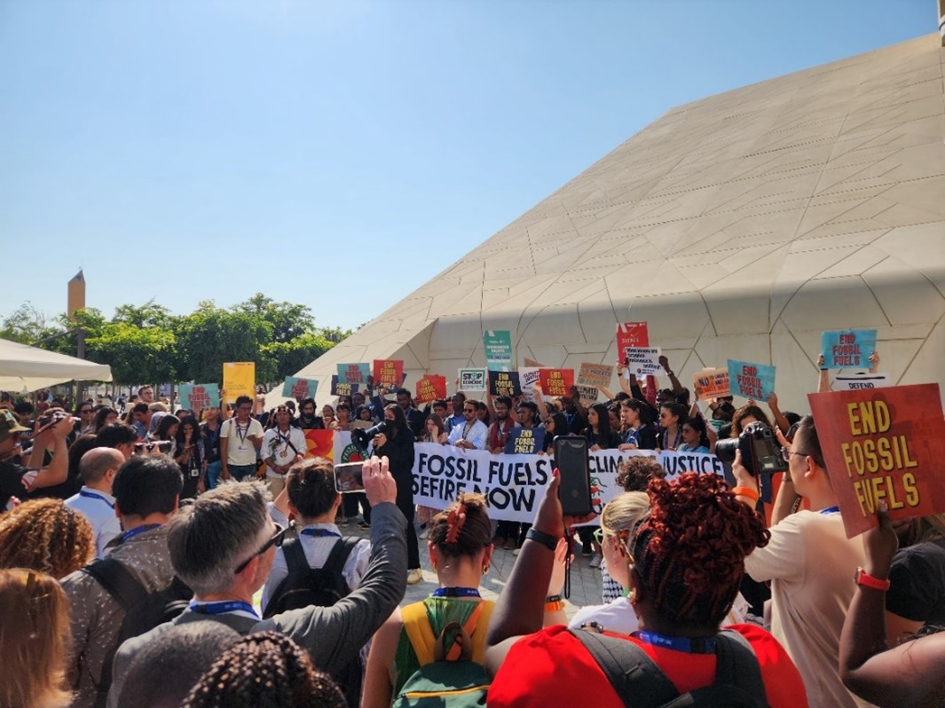 activists demonstrate against fossil fuel at COP28 in Dubai