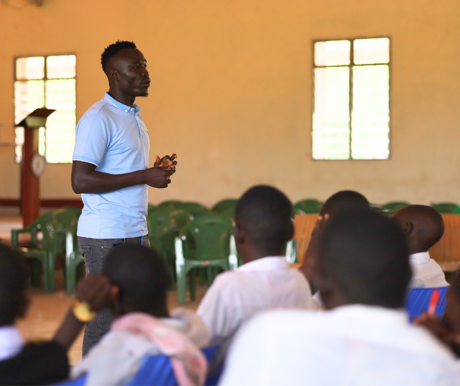 Emmanuel gives a talk about puberty to students at Wau, South Sudan.