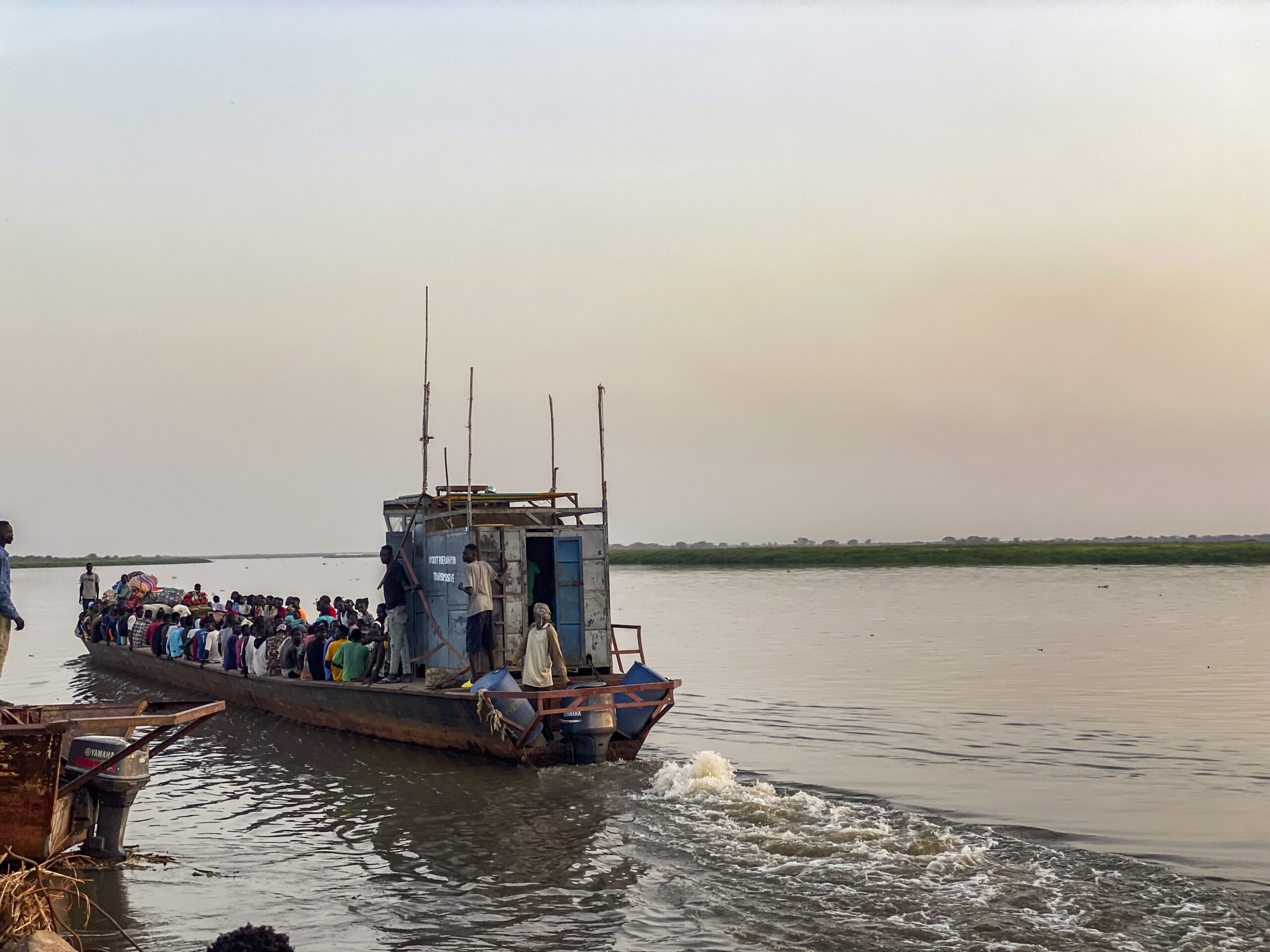 Refugees flee Sudan war by boat soon to dock at Renk.