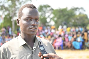 sub-chief community leader speaks to mic for radio