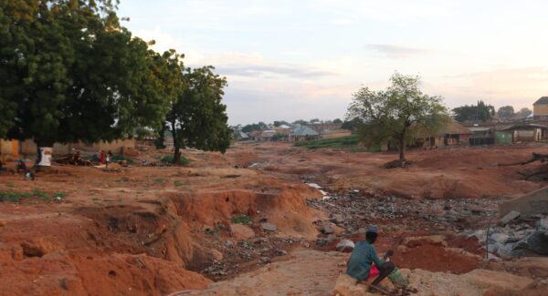 Photo shows destruction and village in aftermath of flooding.