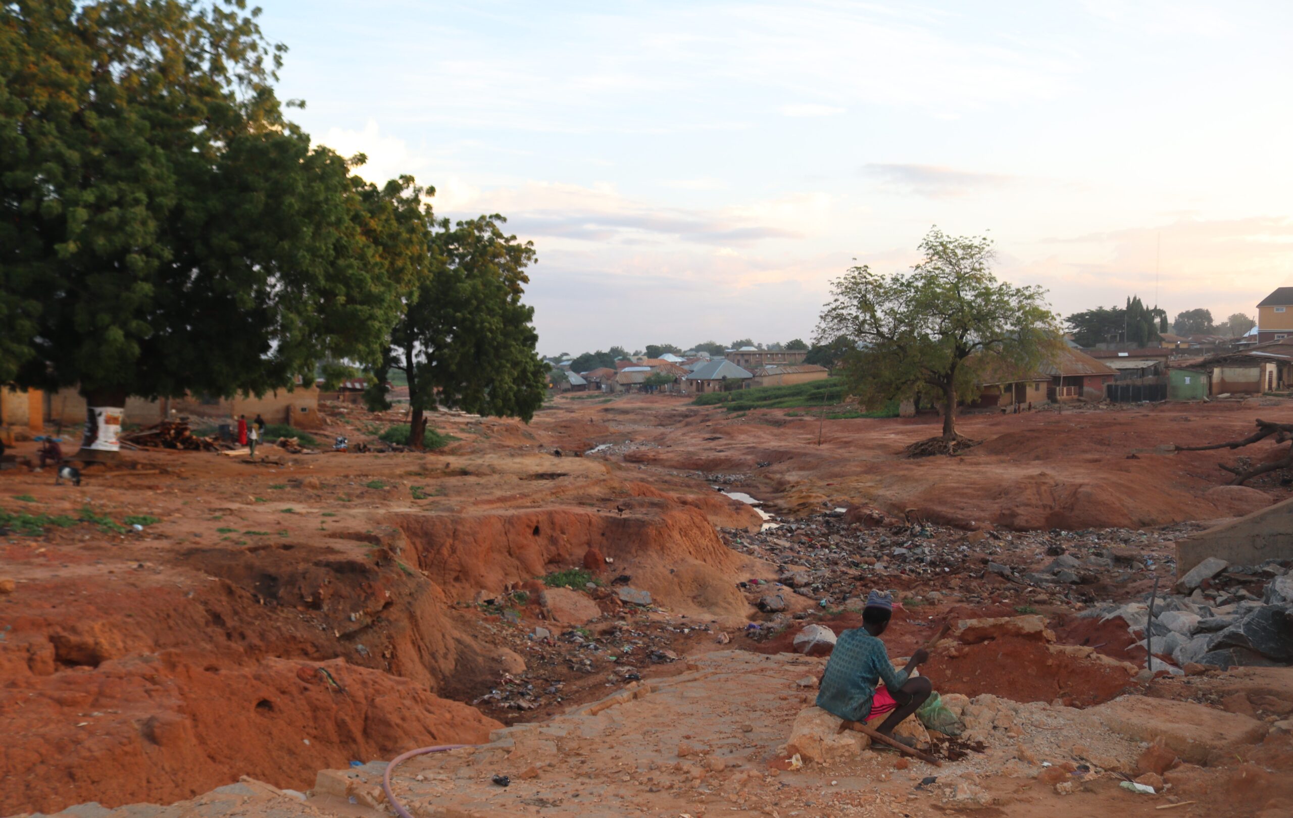 Photo shows destruction and village in aftermath of flooding.