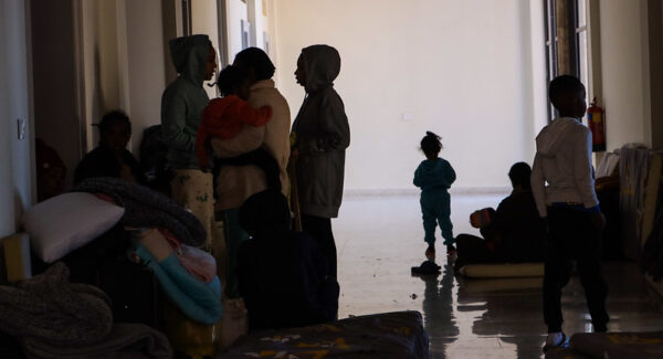 People huddle together taking refuge from bombs in St joseph's church in Beirut.