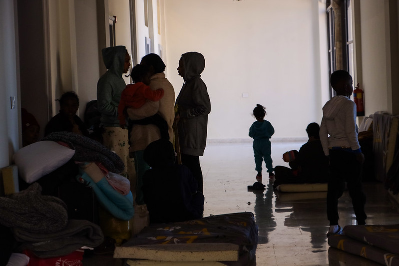 People huddle together taking refuge from bombs in St joseph's church in Beirut.