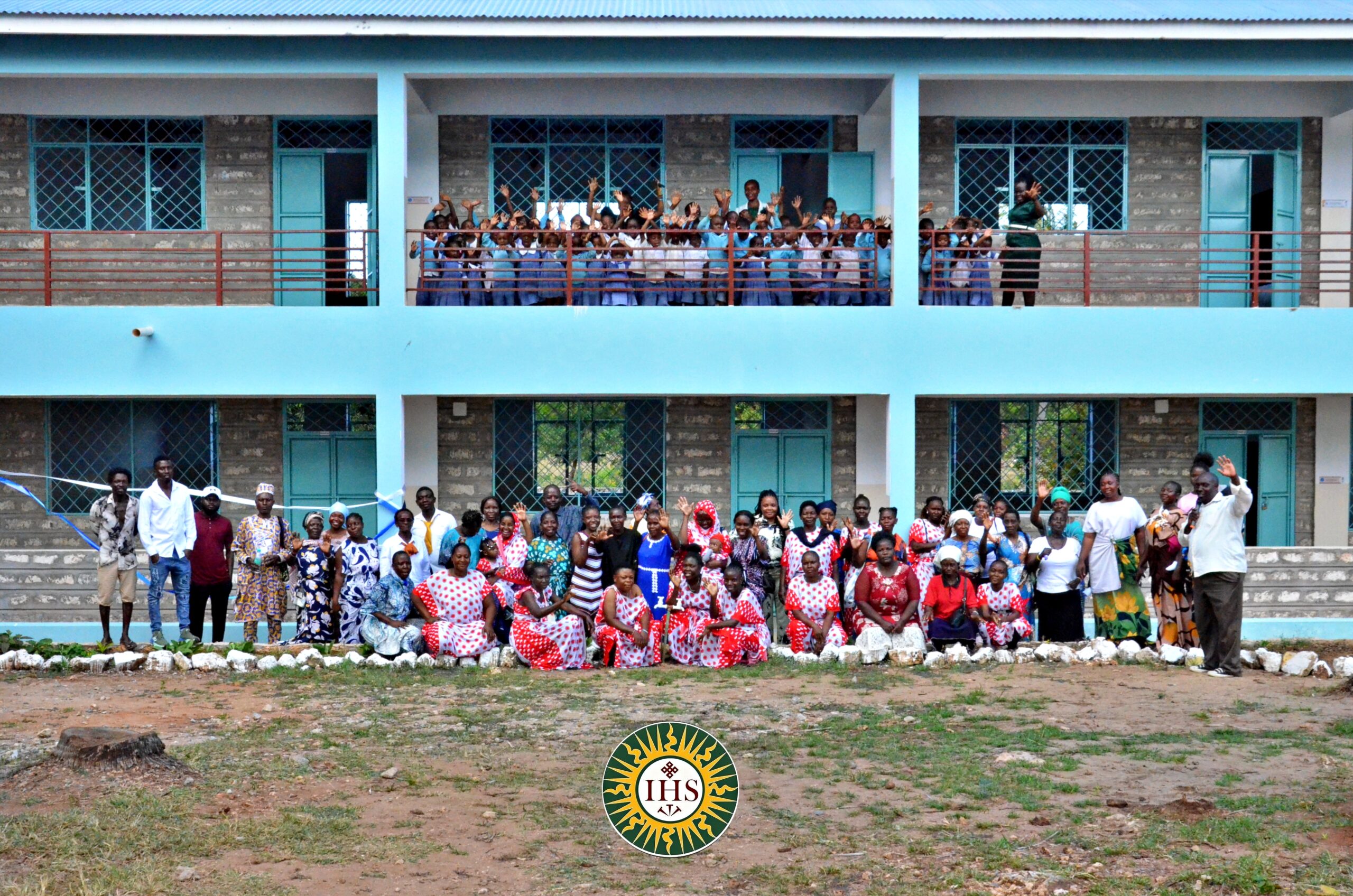 Malindi school opening. community pose for photo outside the school building